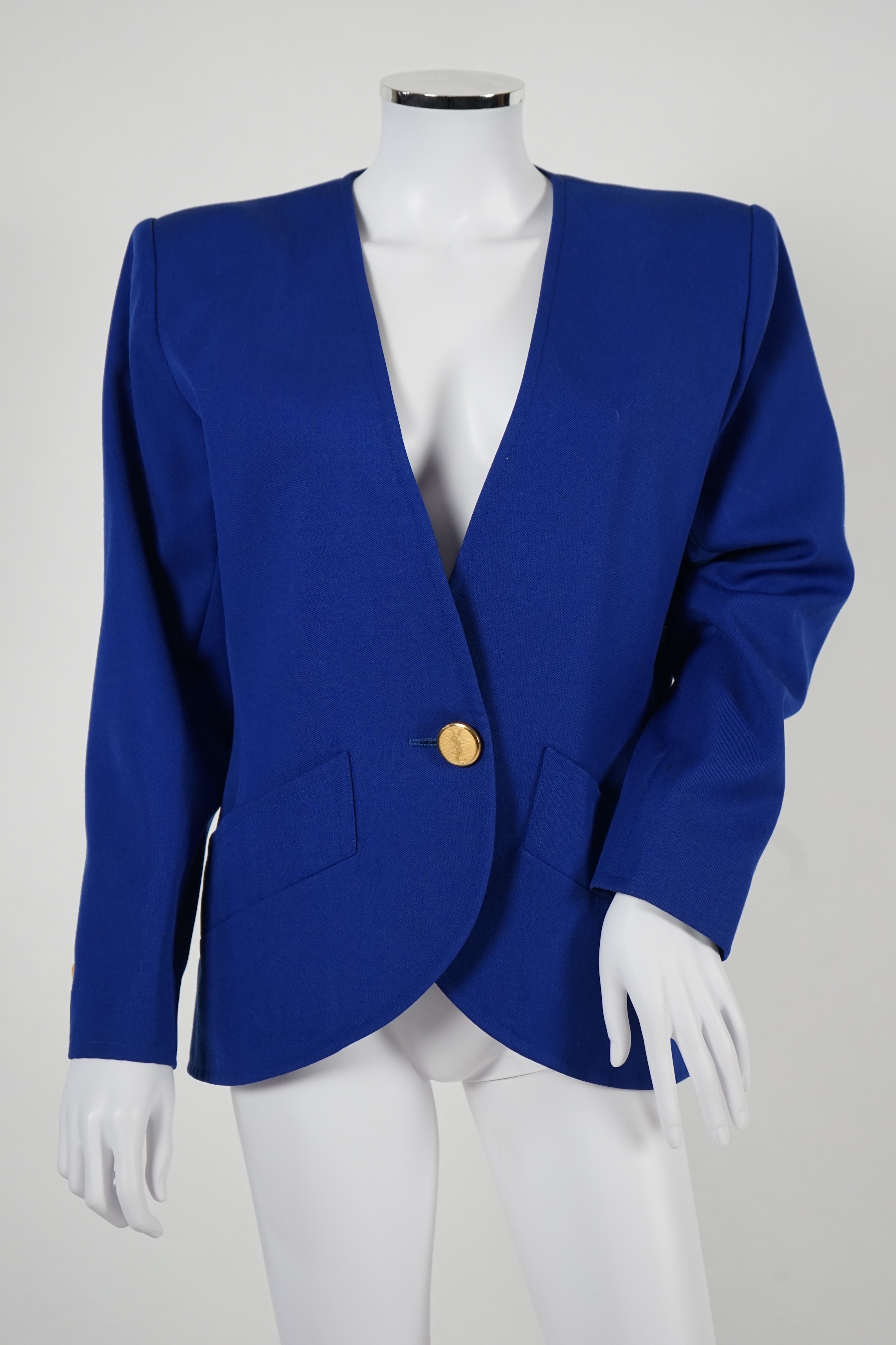 Two vintage Yves Saint Laurent variation lady's skirt suits, royal blue and orange. F 40 (UK 12).Please note alterations to make the waist smaller may have been carried out on some of the skirts. Proceeds to Happy Paws P